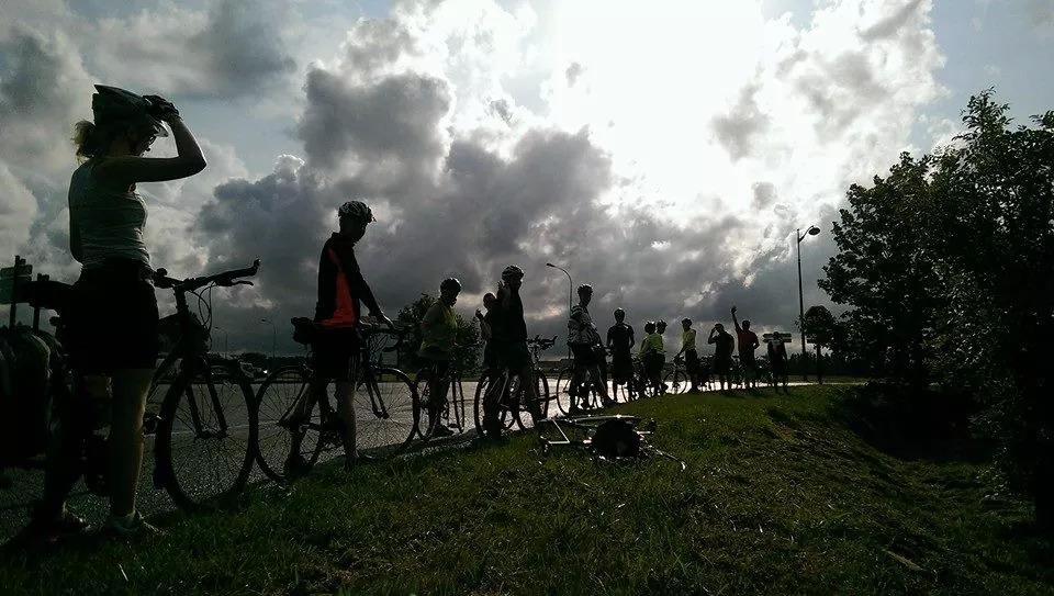 cyclists on the road in silhouette